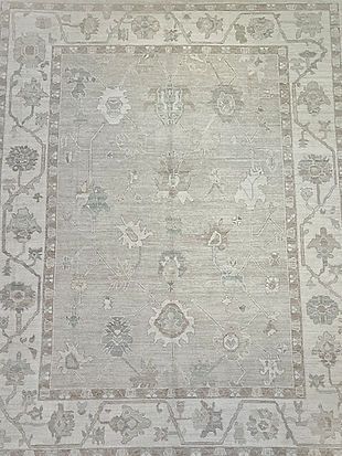A close up of a rug with a floral pattern on it.