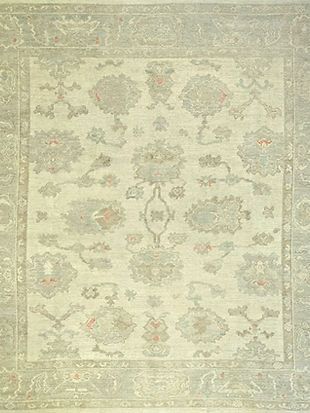A white rug with a floral pattern on it.