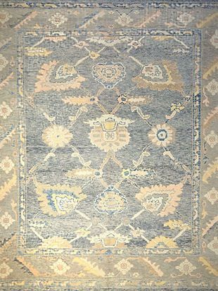 A close up of a rug with a pattern on it.