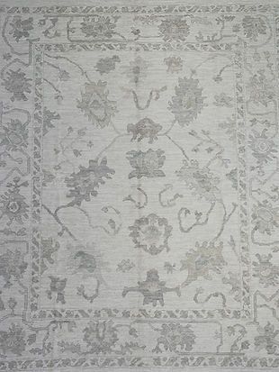 A close up of a rug with a floral pattern on it.