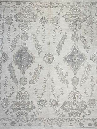 A close up of a rug with a floral pattern on it.