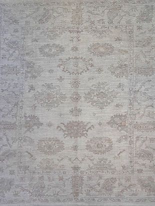 A close up of a rug with a floral pattern on it.