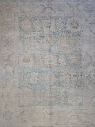 A close up of a rug with a floral pattern on it.