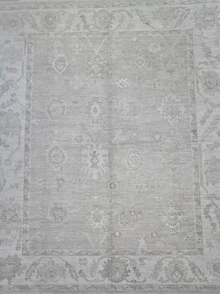 A close up of a rug with a floral pattern on it.