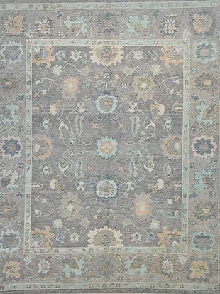 A gray rug with a floral pattern on it