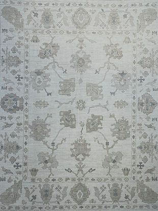 A white rug with a floral pattern on it