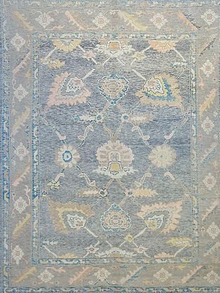 A close up of a rug with a floral pattern on it.