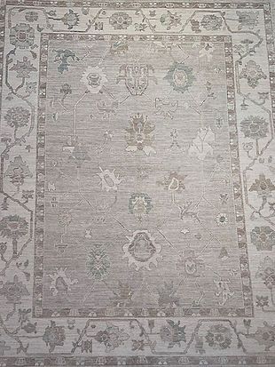 A close up of a rug with a floral pattern on it.