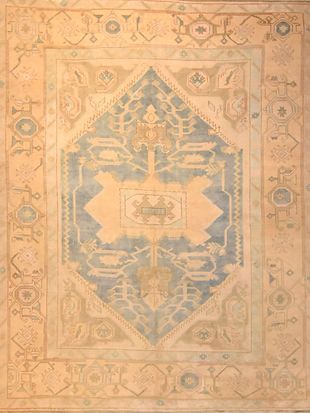 A rug with a geometric pattern on it is sitting on a table.