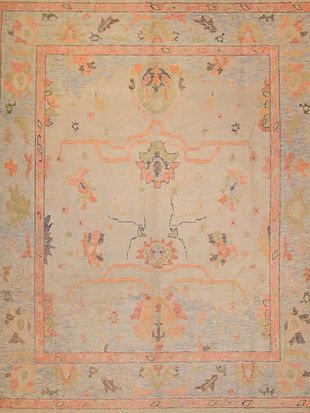A close up of a rug with a floral pattern on it.