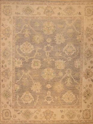 A rug with a floral pattern on it is sitting on a table.