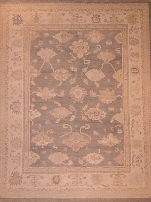 A rug with a floral pattern on it is sitting on a table.