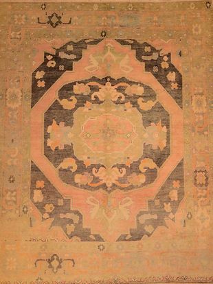 A close up of a rug with a circular pattern on it.