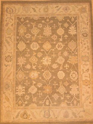 A rug with a floral pattern on it is sitting on a table.