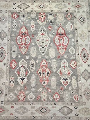 A close up of a rug with a pattern on it.
