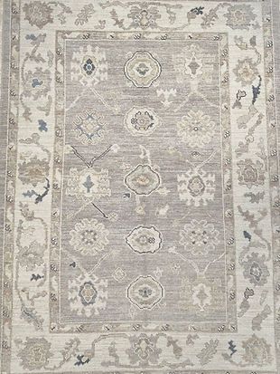 A close up of a rug with a floral pattern on it.