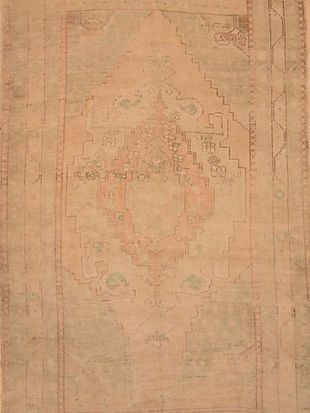 A close up of a rug with a pattern on it.