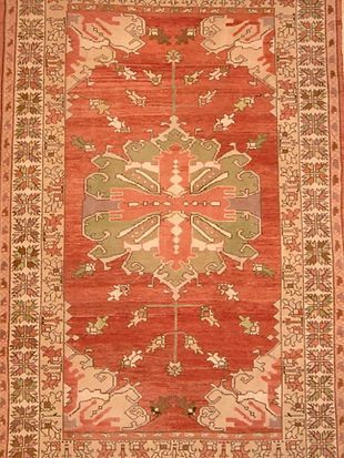 A red rug with a floral pattern on it