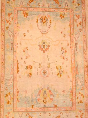A close up of a rug with a floral pattern on it.