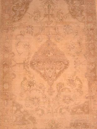 A close up of a rug with a floral pattern on it.