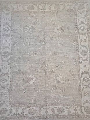 A rug with a pattern on it is sitting on a table.