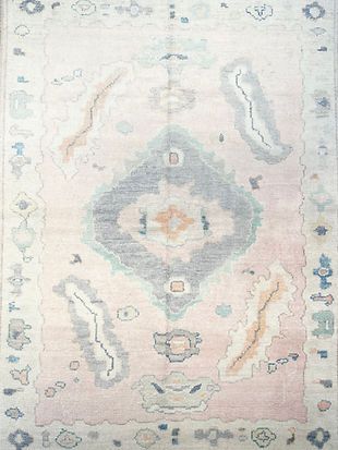 A close up of a rug with a pattern on it.