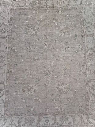 A close up of a rug with a floral pattern on it.