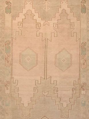 A close up of a rug with a geometric pattern on it.