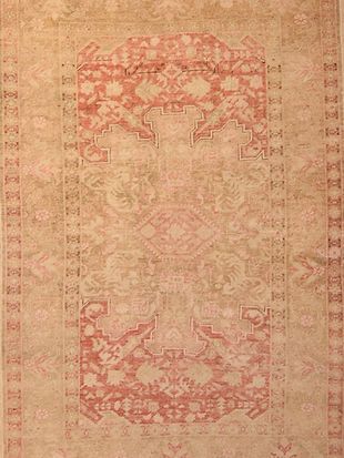 A close up of a rug with a pattern on it.