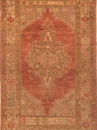 A close up of a rug with a floral pattern on it.
