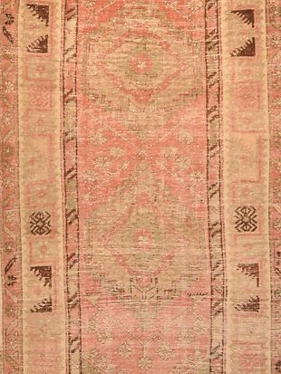 A close up of a rug with a pattern on it.