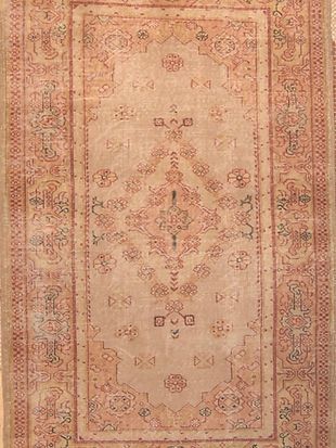 A close up of a rug with a pattern on it.