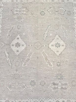 A close up of a rug with a pattern on it.