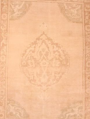 A close up of a rug with a pattern on it.