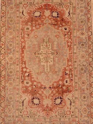 A rug with a cross in the middle of it