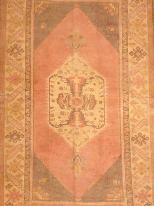 A rug with a pattern on it is sitting on a table.