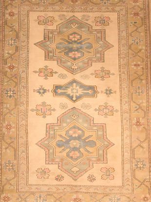 A rug with a pattern on it is sitting on a table.