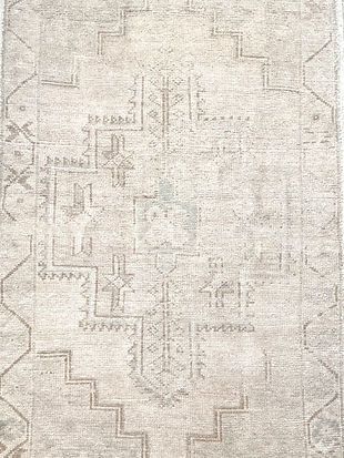 A close up of a rug with a pattern on it.