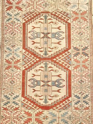 A close up of a rug with a geometric pattern on it.