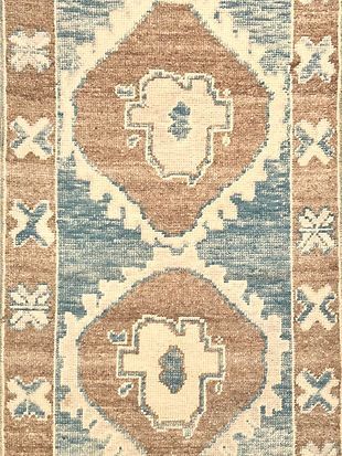 A close up of a rug with a pattern on it.