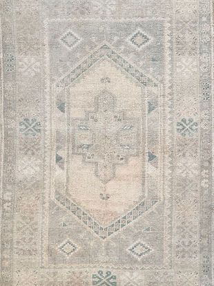 A close up of a rug with a pattern on it.