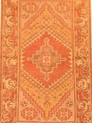 A close up of a rug with a pattern on it.