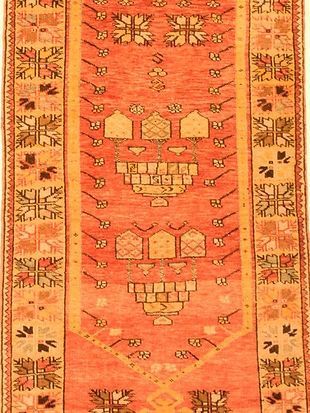 A close up of a rug with a skull design on it.