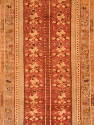 A close up of a rug with a floral pattern on it