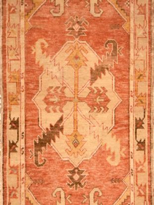 A close up of a rug with a geometric pattern on it.