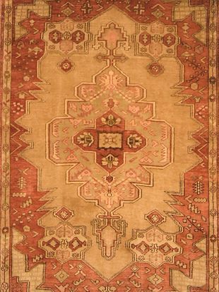 A close up of a rug with a geometric pattern on it.