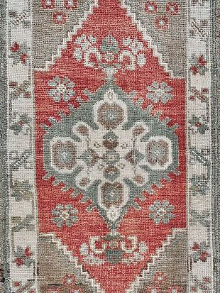 A close up of a rug with a pattern on it.