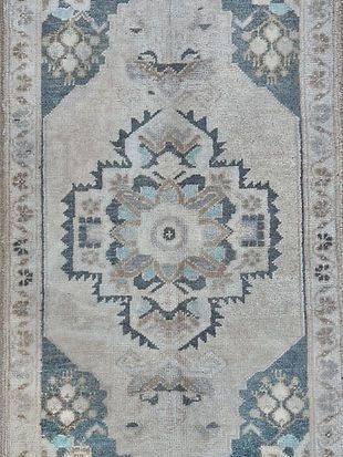 A close up of a rug with a floral pattern on it.