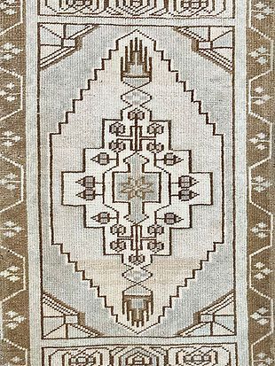 A close up of a rug with a pattern on it.