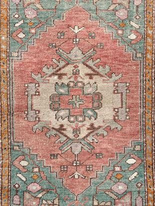 A close up of a rug with a pattern on it.